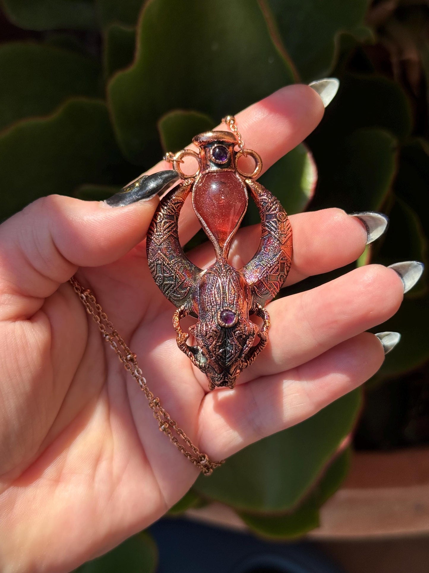 Copper eformed carved resin cat skull with Necronomicon symbols, a magic vial and amethysts on a satellite chain, witchy necklace