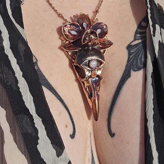 Copper eformed resin raven skull with a real orchid